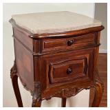 Dark wood side table with two drawers and shell carvings, cabriole legs terminating in casters, with