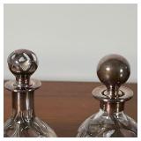perfume bottles with silver overlay, one with indistinct markings and numbered 709 on the bottom of 