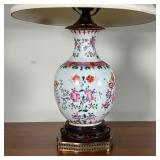 table lamp, fixed to a carved wood stand on a brass openwork base, with a pierced carved pale jade o