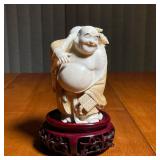 CARVED JOLLY BUDDHA | With old jelly label and on a display stand - h. 5-1/2 in.