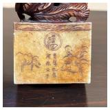 Including a carved stone seal (h. 3-1/8 in.) and a carved wood lion figure