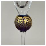 champagne flute with ribbed cup and a cobalt and gilt stem, signed on the bottom and dated 1990; and