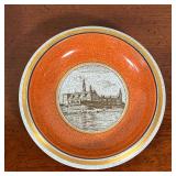 Orange glaze with gilt rims, with cracked ice design throughout, one of them with a transferware ima