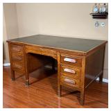 VINTAGE DESK | Solid wood kneehole desk with two banks of three drawers centering a middle drawer; i