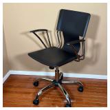 computer armchair, black stitched upholstered seat and connected back rear and matching armrest pads