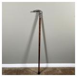 SILVER HANDLED WALKING STICK | Cane with a repousse sterling silver handle - l. 33 in.
