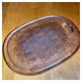 LARGE WOODEN CUTTING BOARD | Large oval wooden cutting board with indented rim and raised on small f