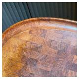 Large oval wooden cutting board with indented rim and raised on small feet - l. 20-1/2 x w. 15 in.