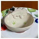 small planters, a small lidded canister, a fun vegetable platter (dia. 12-1/2 in.), and a glass serv