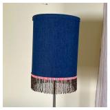 table lamp with beaded tassels hanging from a cylindrical shade, on a metal base - h. 23 in.