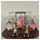 (5pc) DOLLS IN DISPLAY CASES | Some in bell jar glass displays - h. 15-1/2 x w. 10-1/2 x d. 8 in., l