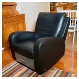 BLACK LEATHER NATUZZI CHAIR | Leather rocking chair on a fully rotating base - h. 38 in x w. 32-1/2 