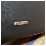 BLACK LEATHER NATUZZI CHAIR | Leather rocking chair on a fully rotating base - h. 38 in x w. 32-1/2 