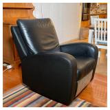 BLACK LEATHER NATUZZI CHAIR | Leather rocking chair on a fully rotating base - h. 38 in x w. 32-1/2 