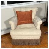 TUFTED ARMCHAIR | Textured fabric upholstery with a tasseled apron mounted on casters - h. 32 x w. 3