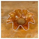 Carnival glass aquatic / shell-shaped bowl with gilt accents and overall iridescence, apparently uns