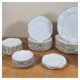 plates, 13 shallow dishes, 14 bread plates, 4 other small plates, 13 saucers; plus 9 similar saucers