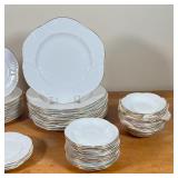  saucers stamped Rosina, all with gilt rims and with sculpted floral shape.