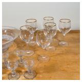 cocktail glasses, and two other glasses; plus a shallow glass bowl and a large, impressively decorat