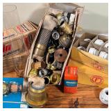 lamp repair parts, including insulated wire, glass hurricane shades, finials, harps, etc.