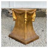 GILT RIBBON FORM DISPLAY PODIUM | Formed fiberglass on a wooden frame with all-over gilt paint, a ve