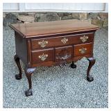 Chippendale low boy, central drawer with a deep concave shell carving, the apron with a single shell