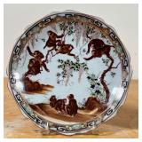monkeys among wisteria branches, partial transferware plates with hand-painted embellishments and wi