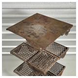 open work shelves and a top solid shelf rotating around a central shaft on a lower base rolling on c