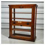  fall down glass down doors revealing four interior wood shelves, with glass paned sides and front -