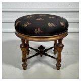 FRENCH FOOTSTOOL  | Gilt French foot stool, circa 19th century, with a black upholstered cushioned t
