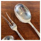 STERLING SERVING PIECES  | Including a serving spoon, pickle tongs, and a cream ladle - l. 10 in. (l