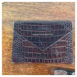 crocodile photograph case (Smythson London), a miniature blotter, and three pairs of folding reading