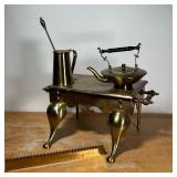 (4pc) MISC. BRASS  | Including a tall pitcher with stirrer, a teapot, and a large trivet - l. 22 x w