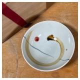 Japanese glazed ceramic rice bowls of small size in a lidded wood box, each bowl with impressed stam