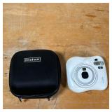 FUJIFILM INSTAX CAMERA  | White Fujifilm instant camera in a hardshell carrying case