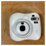 FUJIFILM INSTAX CAMERA  | White Fujifilm instant camera in a hardshell carrying case