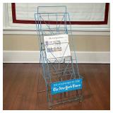 NEW YORK TIMES WIRE RACK  | An early NY Times blue wire display rack with "Find Your World In Ours" 