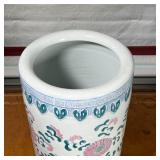 Decorated with flowers and vines the top with a Greek key device and lower border of green reserves 