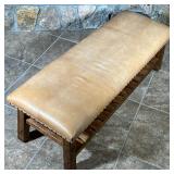 "Caden" bench with cognac / light yellow leather on a wood frame with lower open shelf, brass tacks 