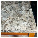 kitchenette table with a grey parquetry stone top on dark wood legs - l. 54 x w. 54 x h. 36 in.