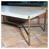 Thomasville coffee table, having a travertine top over a cross stretcher - l. 48 x w. 28 x h. 18 in.