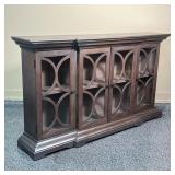 cabinet with four decorated glass doors before two shelves - l. 64 x w. 13 x h. 36 in.