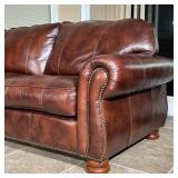 L-shaped couch in 3 sections with scrolled arms, brass tacks, and wooden feet; removable cushions fo