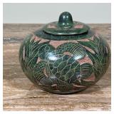 SCULPTED POTTERY JAR  | Of small size, green with incised decoration, signed on the bottom - h. 4 x 