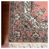 MEDALLION AREA RUG  |  Having a central medallion on a salmon ground with floral arabesque borders -