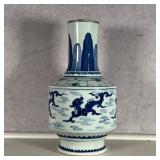 CHINESE BLUE & WHITE VASE  |  Decorated with dragons and clouds, no apparent marking on the bottom -