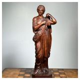 COMPOSITION FIGURE  |  Bronze style composition figure of a woman donning a robe - h. 21 1/4 in.