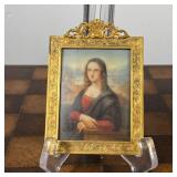 ENAMEL PORTRAIT IN GOLD FRAME  |  Of small size, a reproduction of the Mona Lisa painted on enamel i