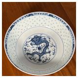 blue underglaze "Made in China" mark, the other unmarked; and a larger center bowl (h. 3.5 x dia. 9.