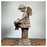 fairy or angel reading on a pedestal, heavy, possibly cement - w. 9 x h. 20 in.